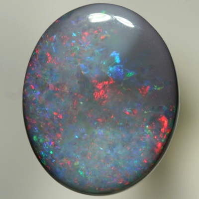 SOLID SEMI BLACK OPAL Red sparkles move over green and purple